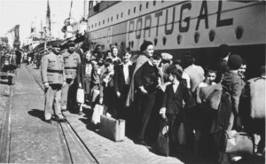 Portugese policemen and Jewish refugee children on the pier next to SS Mouzinho
