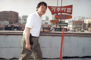 Korean store owner armed with a handgun on the roof of his grocery store to protect his property